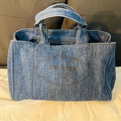 Nwt Good Condition Minor Discoloration Due To Use. Luxury Denim Tote Bag, Luxury Denim Tote Shoulder Bag, Blue Luxury Bag With Pockets, Luxury Blue Bags With Pockets, Luxury Denim Bags With Double Handle, Luxury Denim Bag With Double Handles, Luxury Denim Bags For Shopping, Luxury Denim Shoulder Bag With Double Handle, Luxury Denim Bag For Daily Use