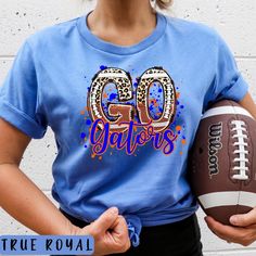 GO Gators Leopard Football Shirt Florida Football Tee Football MOM Shirt Game Day Shirt Florida FOOTBALL Sweatshirt Blue and Orange Tee Introducing our stylish and unique T-shirt that is perfect for Florida lovers and fashion enthusiasts alike! This trendy piece features a bold combination of textures and designs. Adorned with the saying GO Gators with a little leopard to add some flair makes this a fund and trendy design. This shirt showcases your love for the State and University in a fierce a Blue Team Spirit T-shirt For Game Day, Blue College T-shirt For Football Season, Blue Top For College Football Season, Blue Tops With Team Spirit For Football Season, Blue Tops For Football Season With Team Spirit, Blue T-shirt For Game Day With Team Spirit, Blue Tops For Football Season Fan Gear, Blue T-shirt For Game Day, Football Season, Blue T-shirt For Game Day During Football Season