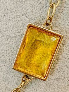 "Vintage Banana Republic long gold tone necklace with amber and yellow colored glass. Signed on the clasp. 29\" long." Formal Gold Chain Necklace With Gemstone, Gold Faceted Rectangular Pendant Jewelry, Gold Faceted Necklace With Rectangular Pendant, Gold Necklace With Faceted Rectangular Pendant, Gold Rectangular Faceted Necklace, Gold Faceted Rectangular Necklace, Yellow Rectangular Citrine Jewelry, Formal Yellow Faceted Necklace, Yellow Metal Necklace With Adjustable Chain