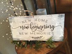 a wooden sign that says new home remodeling, new memories on it