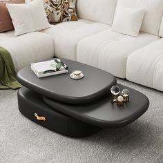 a black coffee table sitting on top of a white couch