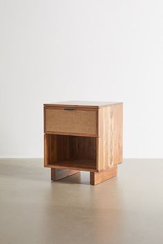 a small wooden table with an open drawer