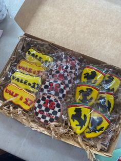 decorated cookies in a box on a table