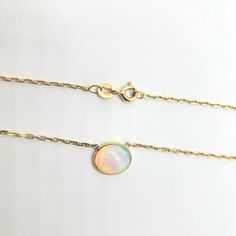 Purity- 18kt Gold Color- Yellow Gold Stone - Genuine Opal Stone Shape - Oval Size Of Stone Design-8mm X 30mm Luxury Opal Necklace With 17 Jewels, Elegant Opal Jewelry With Bezel Setting, Luxury Yellow Gold Opal Jewelry, Luxury Hallmarked Opal Jewelry, 14k Yellow Gold Necklace With Bezel Setting, Gold Opal Jewelry With Round Cut, Luxury Gold Opal Jewelry, Luxury Yellow Gold Opal Necklace, Formal Opal Round Necklace