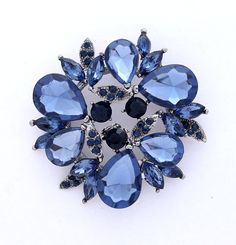 Beautiful rhinestone dark blue brooch bridal jewelry embellishment, which can be used for your DIY project - navy blue wedding bridal brooch bouquet, necklace, bracelet, ring pillow, invitations, cake decorations, event decor, crafts, scrap booking, jewelry gift and much more! Size: 2 inch high 2 inches wide Stone color: Ink blue, midnight blue and navy blue Metal: silver plated This midnight blue crystal brooch can be ordered with pin in the back to wire into brooch bouquet, add to wedding gown Blue Brooch, Cheap Diamond Rings, Bridal Jewelry Vintage, Wedding Brooch, Diamond Brooch, Crystal Brooch, Blue Jewelry, Rhinestone Jewelry, Rhinestone Brooches