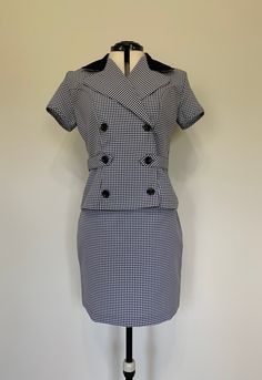 "Awesome vintage two piece top and skirt set with classic 90's black and white plaid pattern. Both pieces in excellent clean, like new, condition. Top has wrap and button closure down front with short sleeves. Skirt is high waisted and shorter in length. Made in USA. Measurements (taken zipped or buttoned up and laid comfortably flat) x 2 for total circumference (inches) *Top* Tag Size 9/10 Shoulder 16.25\"(seam to seam) Shoulder circumference up to 38\" Bust 38\" Waist 32\" Total Length 21\" Sl Retro Fitted Cotton Sets, Classic Fitted Short Sleeve Sets, Fitted Short Sleeve Skirt Suit For Work, Fitted Gingham Cotton Sets, Vintage Fitted Short Sleeve Sets, Tartan Outfit, Two Piece Top And Skirt, Levis Jeans High Waisted, Levis Mom Jeans