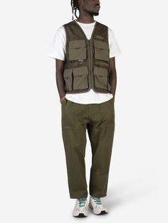 Practicality and durability are the watchwords of Gramicci's Gone Fishing Vest which adds a utility garment perfect for the outdoors to its collection. Perfect for fishing thanks to the multi pockets as well as for casual combinations, it is a vest that can easily be mixed with all types of looks.   Zip closure  Utility pockets with flap  Front zip pocket  Mesh front panel    Fit: Fit regular The model is 185 cm tall and wears size S Fishing Vest Outfit Streetwear, Fishing Vest Outfit, Utility Sleeveless Hunting Vest, Military Style Sleeveless Vest With Cargo Pockets, Fishing Clothes, Military Cotton Vest With Cargo Pockets, Sleeveless Military Vest For Hiking, Fishing Vest, Utility Vest