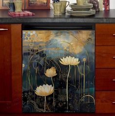 an image of a kitchen scene with white flowers on the counter top and gold foil