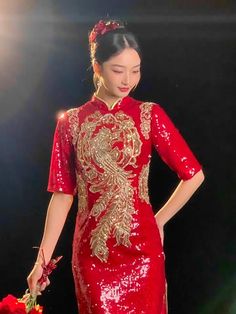 Create a luxurious bridal outfit with a red sequin phoenix cheongsam dress. Look fabulous at your Chinese wedding ceremony in this elegant cheongsam tailored in a classic red color. The traditional phoenix embroidery on the sequin bridal cheongsam symbolizes a harmonious marriage. Sequin Dresses For Celebrations And Festivals, Red Traditional Cheongsam For Evening, Traditional Red Cheongsam For Evening, Red Dresses For Celebration And Festivals, Red Dress For Celebration And Festivals, Party Dresses For Festivals With Short Sleeves, Red Embellished Sequin Wedding Dress, Traditional Evening Cheongsam For Festive Occasions, Traditional Festive Evening Cheongsam