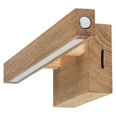 a wooden light fixture with a white light on it's side and a wood beam in the middle