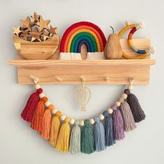 a wooden shelf filled with tassels and other items on it's sides