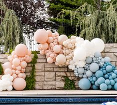 balloons floating in the air next to a swimming pool