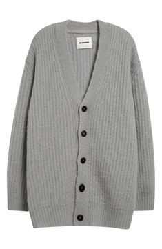 Italian mohair enriched with soft wool yarns offers exceptional warmth and luxe comfort in this ribbed cardigan made even cozier in a relaxed fit with dropped shoulders. 31 1/2" length (size Small) Front button closure V-neck Long sleeves Dropped shoulders Ribbed cuffs and hem 75% mohair, 25% wool Dry clean Made in Italy Designer Clothing Classic Wool Ribbed Cardigan, Classic Ribbed Wool Cardigan, Classic Oversized Knitted Cardigan, Wool Chunky Knit V-neck Cardigan, Classic Mohair Cardigan For Winter, Classic Wool Chunky Knit Cardigan, Classic Mohair Cardigan For Fall, Winter Wool Ribbed Cardigan, Wool Ribbed Winter Cardigan