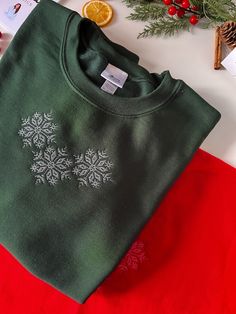 Winter Fleece Sweatshirt With Embroidered Logo, Embroidered Cotton Christmas Sweatshirt, Winter Fleece Tops With Embroidered Graphics, Winter Gift Tops With Embroidered Logo, Winter Tops With Embroidered Logo For Gifts, Winter Tops With Embroidered Logo As Gift, Winter Sweatshirt With Embroidered Logo, Winter Sweatshirt With Embroidered Graphics, Embroidered Fleece Sweater For Winter