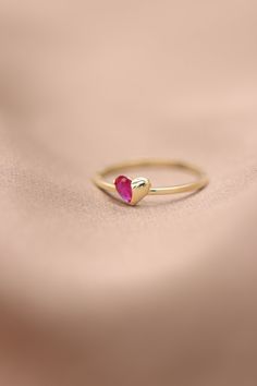 "Handmade Gold Heart With Natural Ruby / 14k 18k Gold Genuine Ruby Ring Available in Gold, Rose Gold and White Gold / July Birthstone ❥ ITEM DETAILS ---> Gold Color of Choice : Yellow Gold, Rose Gold, White Gold ---> Material : 14k ( 585 ) or 18k ( 750 ) Real Gold. It is Not Gold Filled or Gold Plated ---> Made to order ---> Band Thickness : 1.20 mm ---> Band Width : 1.30 mm ---> Ruby Cut: Pear Shape Ruby ---> Number of Stones: 1 Pear Shape Ruby ---> Total Carat : 0.20ct Valentine's Day 14k Gold Ruby Ring, Heart-shaped 14k Gold Birthstone Ring, 14k Gold Heart Cut Red Jewelry, Red 14k Gold Heart Cut Jewelry, 14k Gold Heart-shaped Ruby Promise Ring, 14k Gold Heart-shaped Ruby Ring For Promise, 14k Rose Gold Heart Ring For Valentine's Day, Heart-shaped Yellow Gold Ruby Ring, Heart-shaped Yellow Gold Birthstone Ring