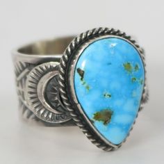 Sterling Silver Ring with Intricate Hand Stamped Designs and set with Natural Kingman Turquoise from Arizona by Navajo Silversmith, Sunshine Reeves. Ring Size: 10.25.625” Setting Width, .875” Setting Height.5” Band Width Southwestern Blue Teardrop Ring, Southwestern Turquoise Teardrop Ring, Southwestern Teardrop Blue Rings, Bohemian Hallmarked Turquoise Ring, Southwestern Blue Chrysocolla Rings, Collectible Multi-stone Blue Turquoise Ring, Southwestern Style Blue Nickel-free Rings, Nickel-free Sterling Silver Turquoise Ring, Nickel-free Round Southwestern Turquoise Ring