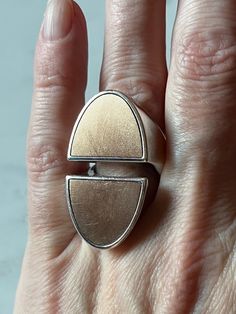 HERMES Chaine d’Ancre Initiale ring, very large model Sz 51 (US 5.5)   Ring in sterling silver and rose gold Made in Italy Silver 925/1000 Rose Gold 750/1000 (not shiny polished, but rather finely textured) Signed HERMES box is included Designer size 51 (approx. US size 5.5) Approx. ring weight (g): 24 Approx. measurements: Band width: 6.5 mm at the thinnest Ring top: E - W: 20mm N - S: 35mm Hermes Jewelry, Hermes Box, Ring Silver, 18k Rose Gold, Silver 925, Jewelry Watches, Jewelry Rings, Silver Rings, Fine Jewelry