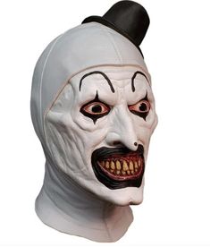 Trick or Treat Studios is proud to present the officially licensed, Terrifier - Art the Clown Mask! This amazing mask is a perfect version of the makeup worn by Art the Clown, with every detail including his crazy eyes, pointy nose and maniacal grin. Order your Official Terrifier Art the Clown Mask today and terrify the neighborhood this Halloween! Art the Clown and Terrifier TM & © Dark Age LLC. All rights reserved. Other Art the Clown, horror and Halloween costumes and accessories (Art the Clo White Horror Masks For Halloween, White Horror Halloween Mask, Horror Halloween Masks And Prosthetics In White, White Horror Masks And Prosthetics For Halloween, White Horror Halloween Masks And Prosthetics, Novelty White Masks For Halloween, Halloween Novelty White Masks, Novelty White Halloween Masks, White Novelty Halloween Masks