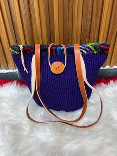 You don't have to be a millionaire to elevate your style and fashion, you need creativity and Arts. We African 1 Stores offers to you the most modern hand made tote bag woven 100% from sisal with Quality leather straps locally tunned from cows.  These beautiful handmade Tote bag originated from craftsmen living in Eastern Community in Kenya, the Akamba. Our Tote bags are woven using colored sisal and leather.The woven bag is made from products which are entirely eco-friendly and sustainable, leather to provide comfort and padding. Leathers are naturally tanned from cows. It has a zipper and an inner lining. This Tote bag is really stylish, functional and eco-friendly for everyday use, summer travels and beyond. From travel to work or a night out, makes it easier to fill your closet with et Be A Millionaire, Handmade Tote Bag, Natural Sisal, Handmade Tote, Woven Tote Bag, Tote Bags Handmade, Woven Bag, Summer Travel, Beach Bag