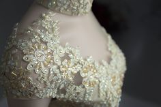 the back of a dress with beading and sequins