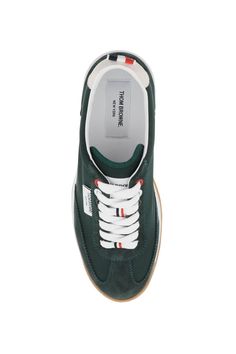 Tech Runner sneakers by Thom Browne crafted in nylon with tone-on-tone suede inserts. Lace-up closure, logo patch on tongue, leather interior with removable insole and tricolor grosgrain loop tab on heel. Clear rubber sole with tricolor inserts. Size Info US Color Detail Green Made In Italia Material 100% calf leather*** 100% PA Season One fall Season Two winter Product shoes Brand Thom Browne Size And Fit Heel Height = 3 cm Latest Fashion Design, Moon Boots, Prada Designer, Sneaker Games, Sporty Look, Diaper Backpack, Thom Browne, Leather Interior, Sneakers For Sale