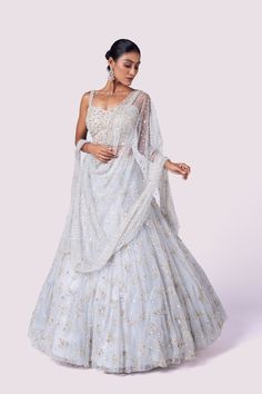 Alluring powder blue embroidered net designer lehenga is perfect for wedding and wedding festivities. Shop online from Pure Elegance. Disclaimer: The actual product may vary slightly from the image. These are custom orders, hence expect slight variation in color and placement of the motif or buta. ESTIMATED DELIVERYBecause this is a custom order, it would take about 4 weeks from the date of purchase. RETURN POLICYThis product is a custom order and cannot be returned or exchanged. Sharara Suits, Wedding Festivities, Lehenga Online, Pure Elegance, Fashion Journals, Designer Lehenga, Traditional Fabric, Anarkali Suit, Designer Sarees