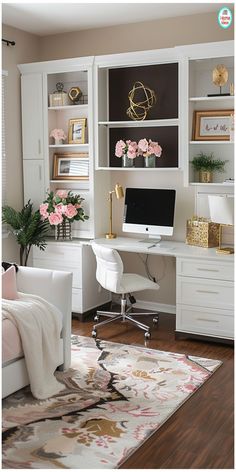 a bedroom with white furniture and pink flowers on the desk, along with a large rug