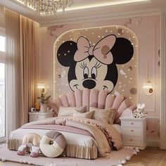 a bedroom decorated in pink and white with a minnie mouse wall mural on the wall