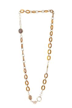 Our Gold Metal Amber Long Chain Crystal Necklace is crafted from links of gold metal and amber-hued resin, adorned with unique stone pendants and heart-shaped charms. This long necklace makes an eclectic statement wherever you go. Wear this out on a sunny day and watch as the sun gleams down making it ever so sparkling. Materials: Glass Beads, Resin Links Size: 40" Long Imported Long Chain, Sunny Day, Stone Pendants, Long Necklace, Crystal Necklace, Gold Metal, The Sun, Glass Beads, Amber