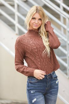 The stretchy textured knit of our Grace Mockneck Sweater makes this stylish sweater also one of the comfiest in your closet. Dress it up with a skirt and booties or jeans and boots because there's no reason to sacrifice your signature style just because it's a little chilly out. Model is 5’7” wearing a size small Length of a small is 19" 54% Cotton, 27% Acrylic, 19% Polyester Stretch Textured Knit Turtleneck Sweater, Stretch Knit Mock Neck Top, Stretch Textured Knit Turtleneck, Fall Knit Mock Neck Turtleneck Top, Trendy Knit Funnel Neck Sweater, Knit Turtleneck Mock Neck Top For Fall, Winter Textured Knit Stretch Turtleneck, Trendy Funnel Neck Knit Sweater, Trendy Knit Turtleneck Sweater