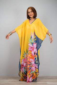 "Beach kaftan, Chiffon dress with big floral print, Sheer Boho summer dress, Long maxi dress perfect as swimsuit cover up  It is a very stylish garment and the long sleeves definitely give it that romantic touch. Smooth as silk Collection--> Produced by NUICHAN & Co PRODUCT SIZE :  * Chest : max 58\" * Waist : max 58\" * Hips : max 58\"  * Length : 55\" from shoulder to hem * Sleeve Length : 17\" from neckline to hem MATERIAL  * Chiffon * Print can be in a slightly different position. MODEL : * V-neck Floral Print Maxi Dress For Beach, Long Printed Beach Dress For Beach Cover-up, Flowy V-neck Beach Dress With Tropical Print, Tropical V-neck Maxi Dress For The Beach, Bohemian Chiffon V-neck Cover-up, V-neck Chiffon Beach Cover-up, Floral Print Flowy Maxi Cover-up, Summer V-neck Chiffon Kaftan, Yellow V-neck Beachwear Maxi Dress