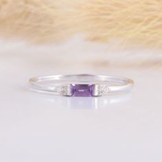 925 sterling silver small & delicate womens promise ring, Tiny petite silver amethyst promise ring for her,Baguette cut purple amethyst ring WE OFFER UNLIMITED PERIOD INSTALLMENTS PLAN This is a beautiful, stunning, feminine ring that works well for all occasions, styles, and ages. You will love it! Ring information: Main stone: Amethyst Approximate size: 4x2mm Accent stones: Cubic zirconia Approximate size: 1.5mm (2 stones) Metal type: Silver Metal stamp: 925 sterling silver Installment Pay Promise Ring For Her, Purple Amethyst Ring, Fancy Gifts, Amethyst Gem, Promise Rings For Her, Purple Band, Baguette Cut, Rings For Her, Amethyst Ring