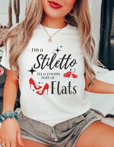 Stiletto In A Room Full Of Flats, Sassy T Shirt, Sarcastic Shirt, Sassy Mom Shirt, Sassy Wife Shirt, Cute Ladies Shirt,Funny Women Shirt, Gift For Her 👚 PRODUCT Bella+Canvas 3001 Unisex T-Shirt * 100% Airlume combed and ringspun cotton *(fiber content may vary for different colors, see below for further info) * Light fabric (4.2 oz/yd² (142 g/m * Relaxed fit for Women; Retail fit for Men * Runs true to size * Fabric Blends: * Ash color is 99% combed and ring-spun cotton, 1% polyester * Heather Stretch T-shirt With Letter Print For Party, White Stretch T-shirt For Party, Funny White Party Top, Funny Women, Ladies Shirt, Sarcastic Shirts, Women Humor, Women Shirt, Roll Up Sleeves