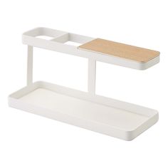 a white shelf with a wooden top and two shelves on each side, one holding a tray