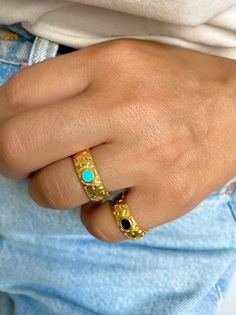 Two different handmade rings in gold color. Both of them have floral shape as designs and an oval enamel stone at the center. The first one is black and the second one is turquoise. Both of them are slightly adjustable. In Christina Christi Jewels store you can see a lot of designs in Women's Rings. You can have them in 2-4 Days with DHL EXPRESS SHIPPING DIMENSIONS - Rings Diameter is 17mm (0.67'') - US 7 - Floral Ring: 22x21 mm (0.86x0.82) - Slightly Adjustable. MATERIALS - Gold Plated 24k Pewt Unique Gold Jewelry With Black Enamel, Gold Turquoise Ring For Gift, Gold Turquoise Ring Gift, Gold Turquoise Ring With Gemstone, Unique Gold Enamel Ring, Gold Turquoise Ring Birthstone For Gift, Gold Turquoise Birthstone Ring Gift, Oval Enamel Rings With Gemstone, Adjustable Gold Turquoise Ring With Oval Shape