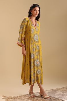 Yellow dress with geometric print and sequin, bead embroidery. - Aza Fashions Fitted V-neck Dress With Mirror Work, Festive V-neck Printed Dresses, Elegant Printed Dresses For Festive Season, Elegant Printed Dresses For Festive Occasions, Festive Maxi Length Printed Dresses, Festive Floor-length Printed Dresses, Yellow V-neck Dress For Festive Occasions, Yellow V-neck Festive Dress, Festive Yellow V-neck Dress