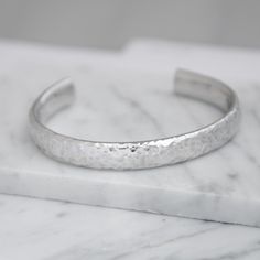 Stylish Hammered cuff style bangle in Sterling Silver .925 The perfect gift for any Birthday, Anniversary, or Christmas to your loved one. If you have any questions or would like to know additional details please feel free to reach out and ask us. We be happy to answer any question you may have. We want YOU to feel comfortable buying not only from us but also comfortable with the item you want to purchase. Highly polished Sterling Silver THE BANGLE IS MADE FROM STERLING SILVER (NOT PLATED) DELIVERED  IN A GIFT BOX Gift Luxury, Sterling Silver Bangle, Cuff Bangle Bracelet, Hammered Sterling Silver, Sterling Silver Bangles, Cuff Bangles, Bracelets And Charms, Silver Bangles, Birthday Anniversary