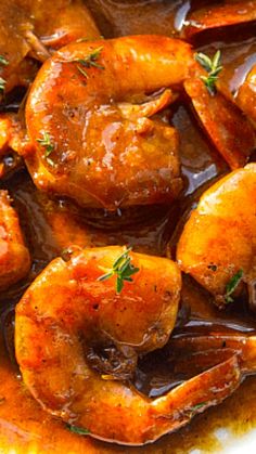 cooked shrimp with gravy in a white bowl