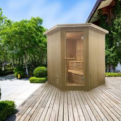 an outdoor sauna is shown in the middle of a wooden decked patio area