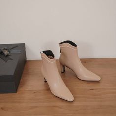 Looking for the perfect pair of shoes to transition from summer to fall? These nude ankle boots are just what you need! Made with a square toe and 2'' heel. they are both stylish and comfortable. The leather material is also perfect for pairing with any outfit.  Upper: Leather Lining: Leather Outsole: TPR Toe: Square Toe Heel: 7cm/2.8'' Closure: Zip Color: Nude. Burgundy is_handmade: Yes The above measurement is based on size 6. with one size larger. 0.5cm wider. Elegant Low Heel Heeled Boots For Spring, Elegant Block Heel Boots For Spring, Beige Low Heel Boots, Chic Beige Heeled Boots For Spring, Chic Spring Mid-calf Boots With Low Heel, Beige Square Toe Boots For Spring, Beige Square Toe Heeled Boots For Spring, Chic Square Toe Mid-calf Boots For Spring, Chic Beige Boots With Stacked Heel