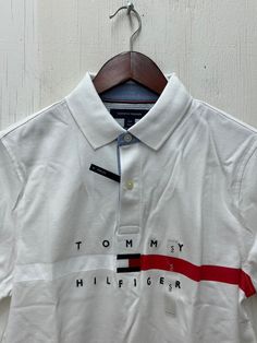 Tommy Hilfiger Men's Nial Short Sleeve Custom Fit Polo T-Shirt Bright White 78J4952 110 Collared Cotton T-shirt With Logo Print, Cotton Collared Top With Logo Print, Cotton Polo Collar Shirt With Logo Print, Collared Tops With Logo Print For Summer, Summer Collared Tops With Logo Print, Summer Collared Top With Logo Print, Tommy Hilfiger Cotton Tops With Logo Print, Tommy Hilfiger Cotton Shirt With Graphic Print, Casual Fitted Tommy Hilfiger Polo Shirt