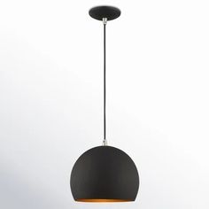 a black and gold pendant light hanging from a ceiling