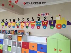 a child's room with lots of toys and numbers on the wall