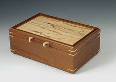 a small wooden box with two compartments