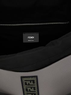 'Strike Large Fendi Roma' backpack in grainy leather, flap with embossed logo and Velcro closure, pockets, drawstring closure, adjustable and removable shoulder straps, removable shoulder strap. Composition: 100% bos taurus Logo Flap Shoulder Bag For Travel, Leather Flap Shoulder Bag With Logo, Travel Shoulder Bag With Logo And Flap, Travel Shoulder Bag With Flap And Logo, Designer Leather Backpack With Top Handle, Leather Backpack With Logo, Functional Leather Bag With Logo, Designer Leather Backpack With Logo, Leather Travel Backpack With Logo