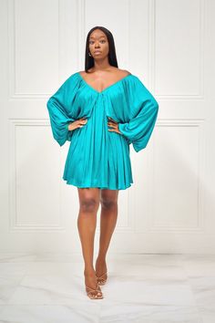 As Kenya Moore would say, 'Gone with the Wind Fabulous'. You'll definitely be muttering that as you sashay down the street in this gorgeous blue dress with long sleeves, a classic V neck at the front and back, full lining and back tie detail. No one will accuse you of not being a fashion maven with this on! Pair with gold accessories for an elegant look! CONTENT & CARE Hand wash with cold water Do not bleach Iron on low heat Self and Lining: Polyester DEETS & FIT Model is wearing a size Flowy Long Sleeve V-neck Dress For Party, Chic Off-shoulder Long Sleeve Evening Dress, V-neck Long Sleeve Dress For Summer Evening, Chic Off-shoulder Long Sleeve Dress For Spring, Blue Mini Length Long Sleeve Dress For Spring, Blue Mini Long Sleeve Dress For Spring, Blue Long Sleeve V-neck Dress For Spring, Long Sleeve Off Shoulder Dress For Fall Date Night, Chic Blue Long Sleeve V-neck Dress