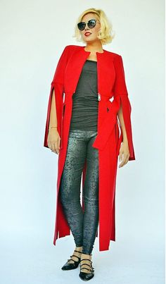 Coat for women with fringes, very playful, bold and daring. Versatile wool jacket, lined with satin in the upper side. The beautiful long coat color will for sure steal the spotlight this fall! This piece is a key element in the LA RAMBLA Collection, being a smooth cocktail of elegance, class, avant-garde and the very modern vibe of the urban scenery in which we live in. Material: 30% wool, 70% polyester Care instructions: Dry clean only The model in the picture is size S. Can be made in ALL SIZ Fall Wool Cape Coat For Work, Chic Fall Cape Wool Coat, Spring Evening Cape Outerwear, Evening Spring Cape Outerwear, Evening Wool Coat For Fall, Long Winter Outerwear For Evening, Long Winter Evening Outerwear, Cape Outerwear For Fall Parties, Fitted Cape Outerwear For Party