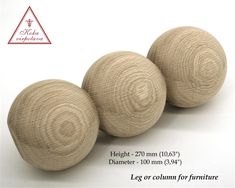 three wooden balls sitting next to each other on a white surface with measurements for them