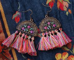 "Dangly treats for your ears featuring curtains of multicolored tassels swinging from gorgeous filigree fan-shaped pendants with hand-painted pink flower accents! Just pop them in your ears to add feminine, flirty, floral style to any outfit! And you can wear them happily because they are lightweight and super comfy, so no annoying pulling on your ears as they sway! Add these fun and fabulous Boho beauties to your jewelry box! Antiqued Copper-plated Earrings Earwires, Antiqued Copper-plated Pend My Best Friend's Birthday, Boho Beauty, Art Nouveau Jewelry, Chic Jewelry, Hippie Jewelry, Hippie Bohemian, Shell Earrings, Floral Style, Bohemian Jewelry