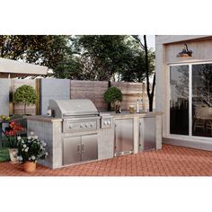 an outdoor kitchen with grill and patio furniture